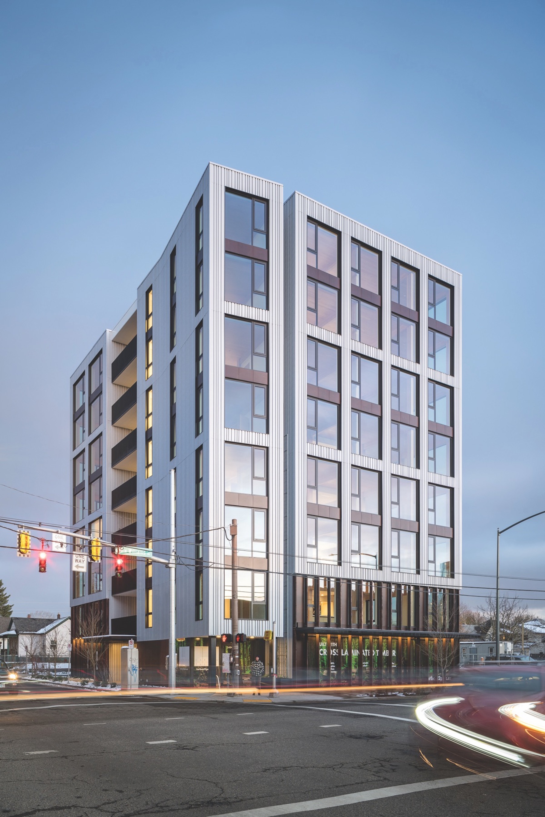 Mass timber for multifamily housing construction - Carbon12 exterior night.jpeg