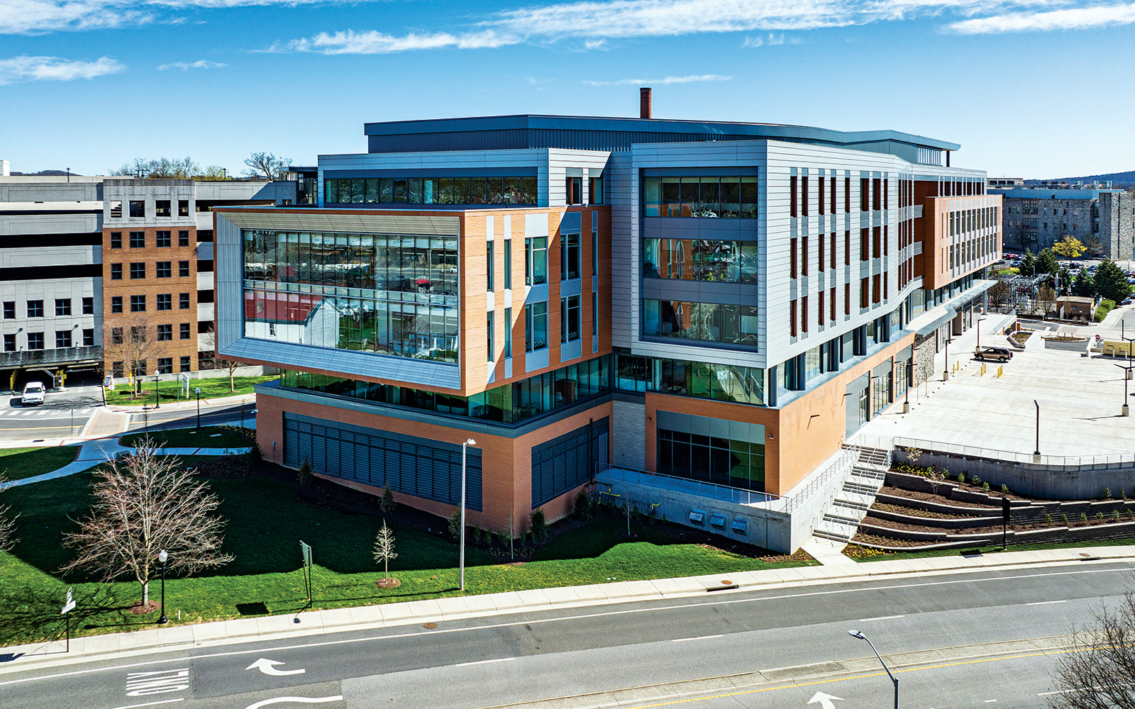 Gilbert Place at Virginia Tech uses QuadCore<sup>®</sup> KarrierPanel<sup>®</sup> by Kingspan to create a facade combining stone, glass and metal.