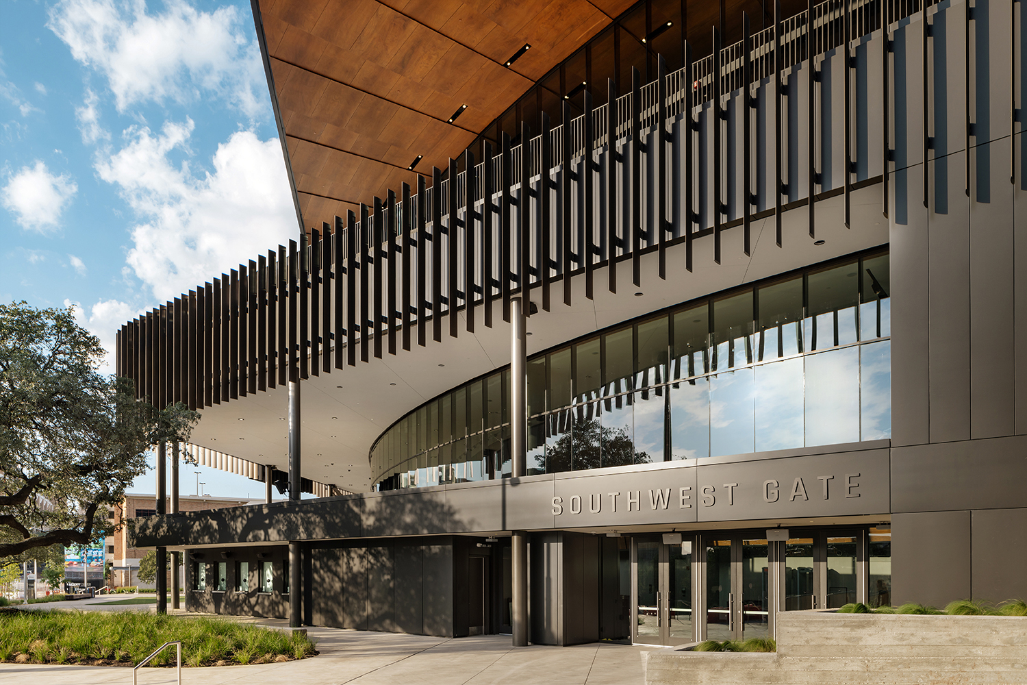 ALPOLIC MCM features on Southwest Gate entrance and the arena’s eye-catching roof fascia, in a custom dark bronze finish