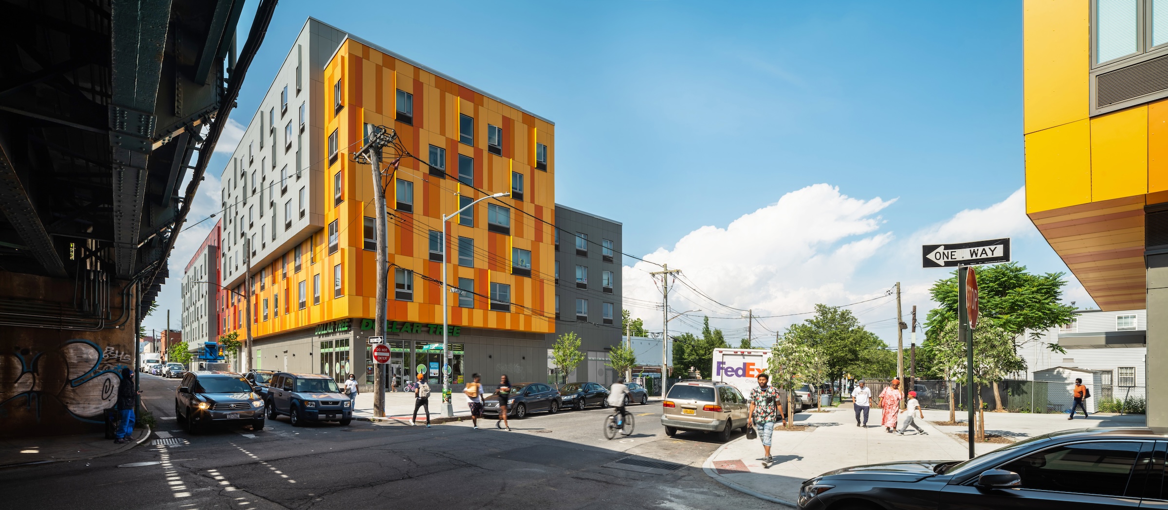 Brooklyn's colorful Van Sinderen Plaza affordable housing project includes retail, public spaces. Photo courtesy GLUCK+