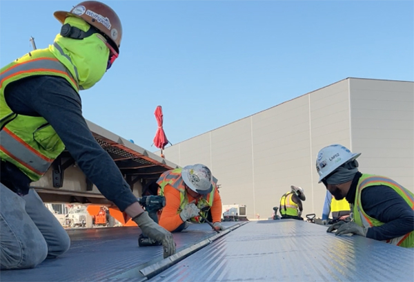 Installation Teams Assemble Metl-Span Insulated Metal Panels™. Photo credit - Impatient Cow Productions